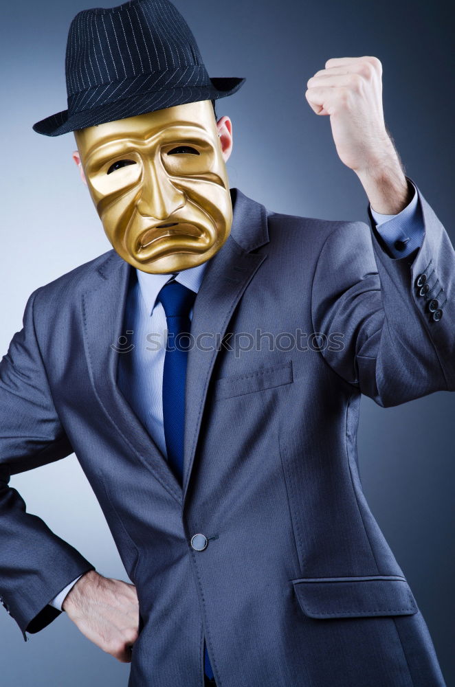 Similar – man is holding a creepy Mask