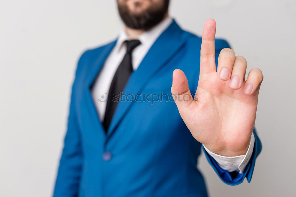 Similar – Barber cutting beard to man in salon