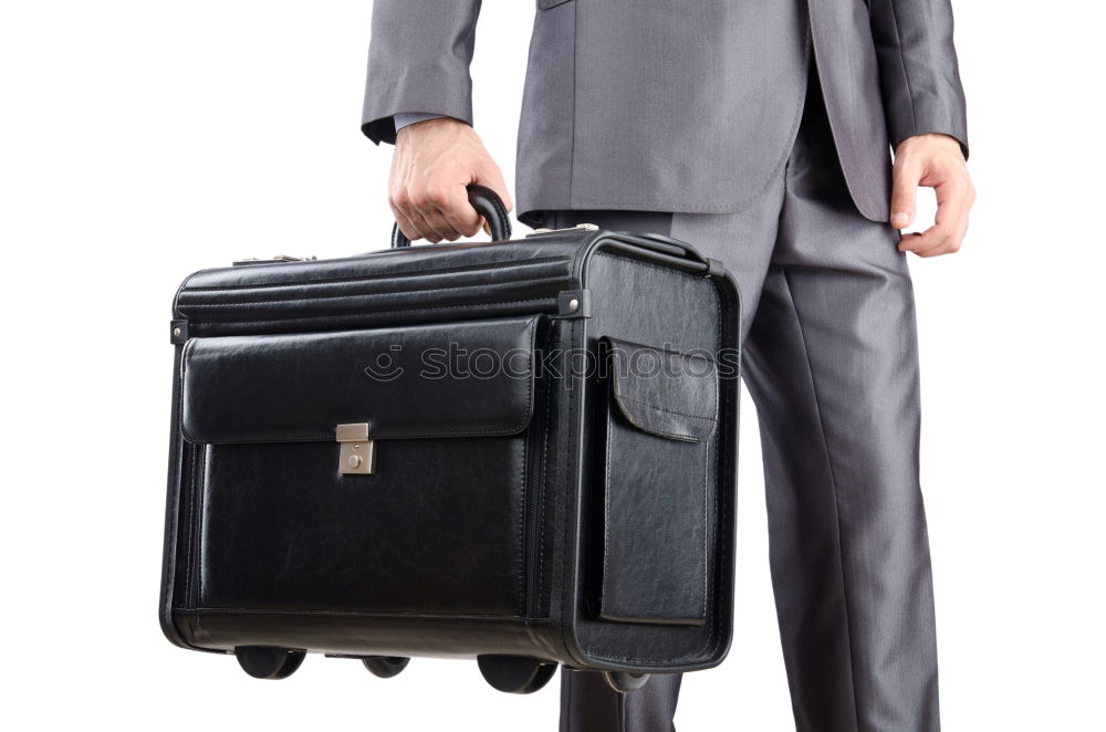 Similar – one person holds a leather travel bag in his hand