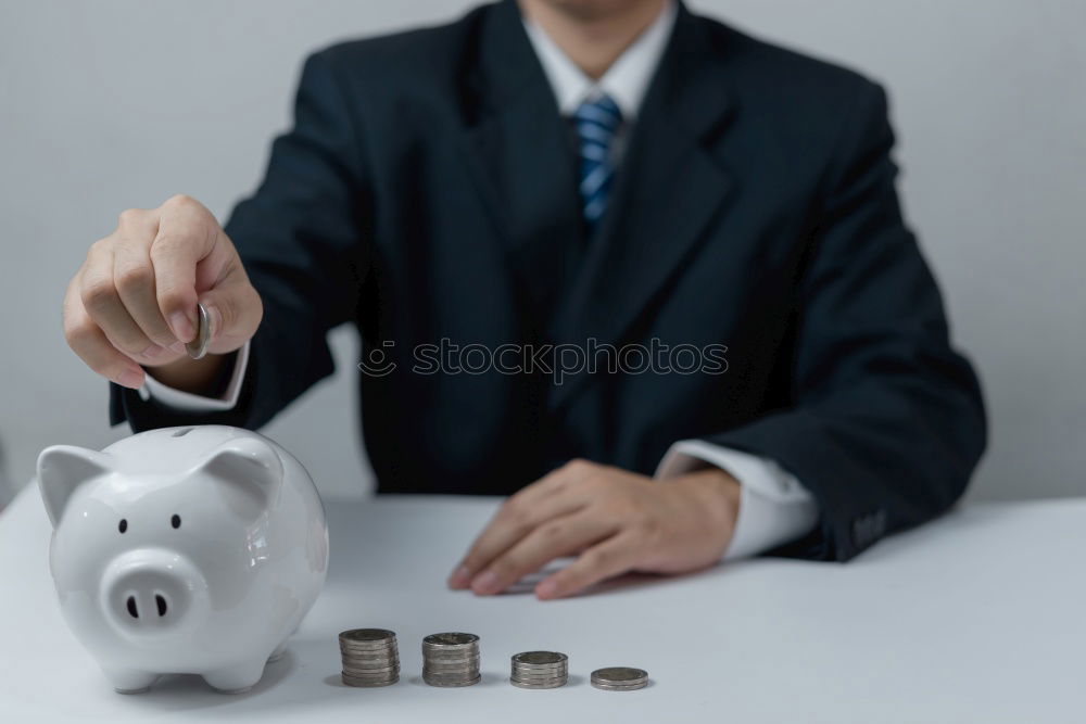 Similar – Image, Stock Photo Unhappy man angry at his piggy bank