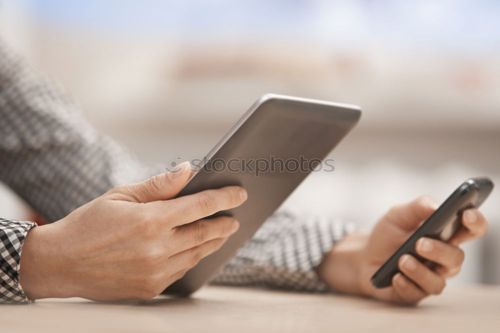 Similar – Close up of hands using smartphone