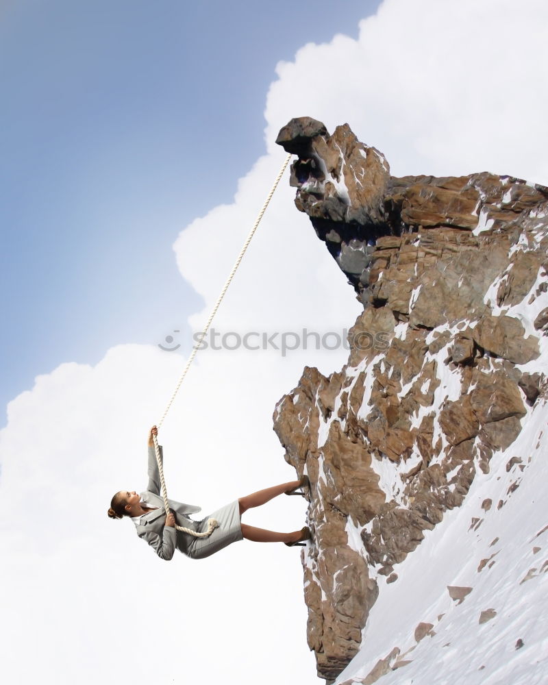 Similar – Climber reaching for a helping-hand.