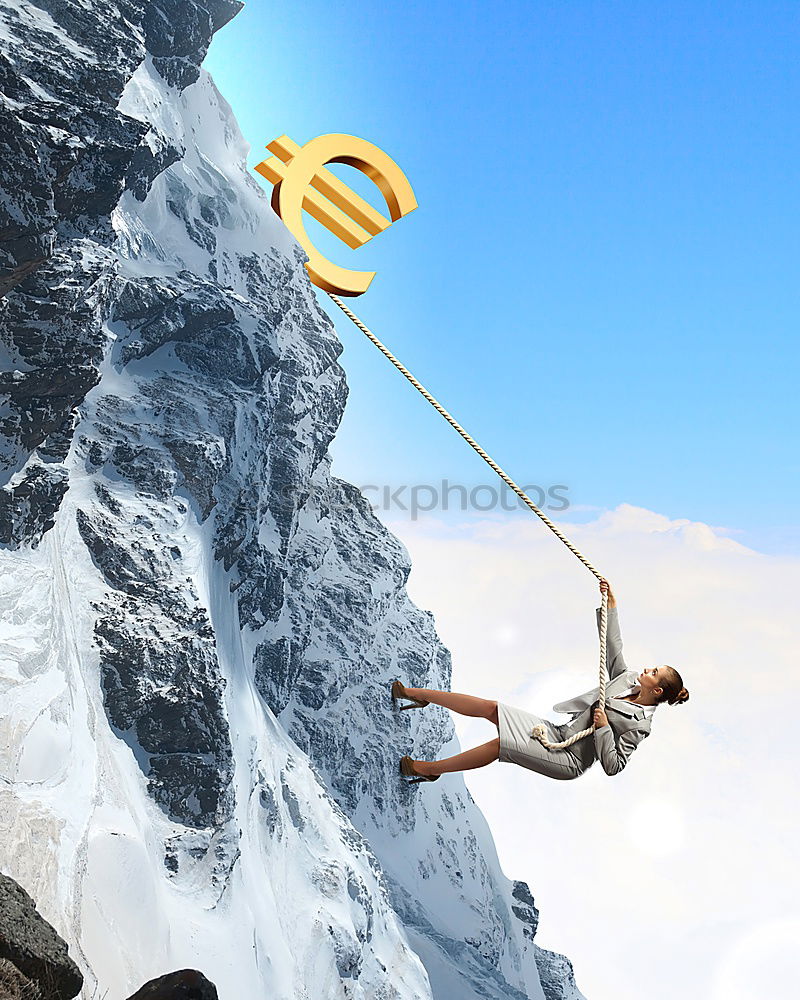 Similar – Climber and his camp dangling from a cliff.