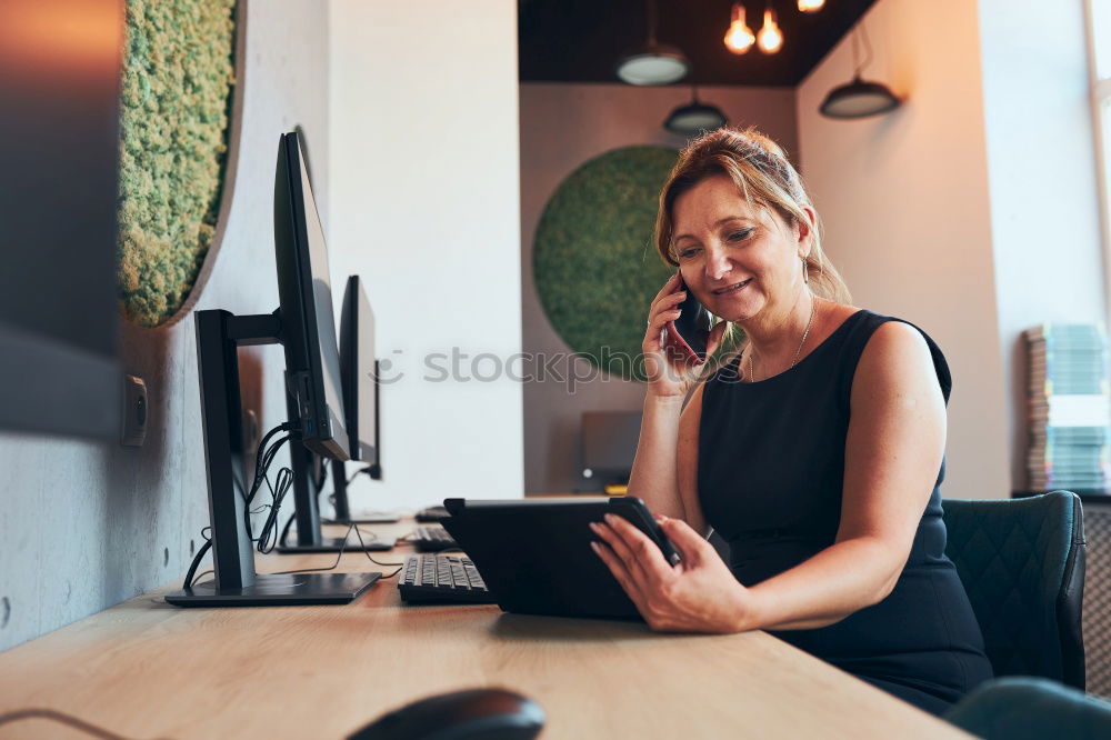 Similar – Young woman sitting at a kitchen table