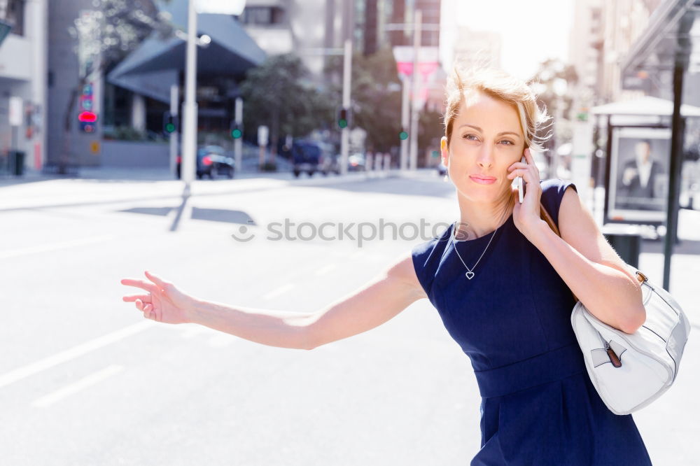 Similar – Attractive blond woman checking her mobile phone