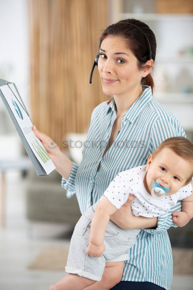 Similar – Mother breastfeed baby while playing with smartphone