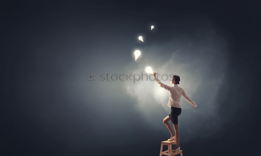 Athletic man balancing on gymnastic rings