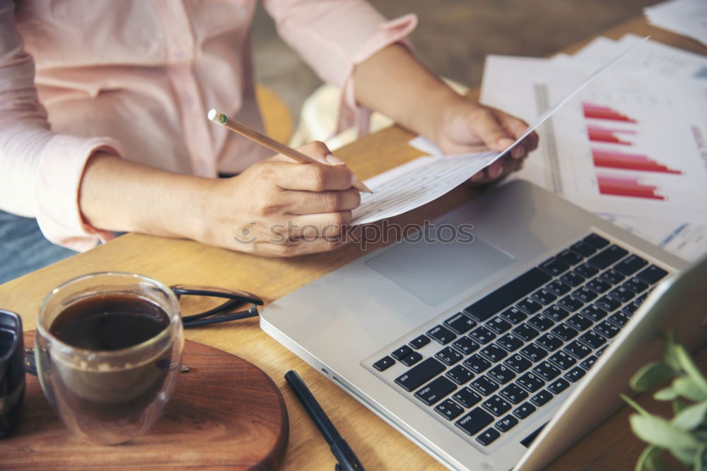 Similar – Young adult woman working on laptop in cafe