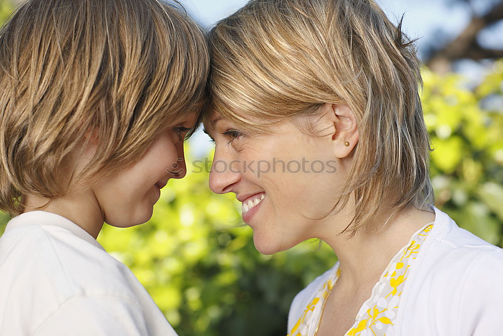 Image, Stock Photo Mother and son seated on a park