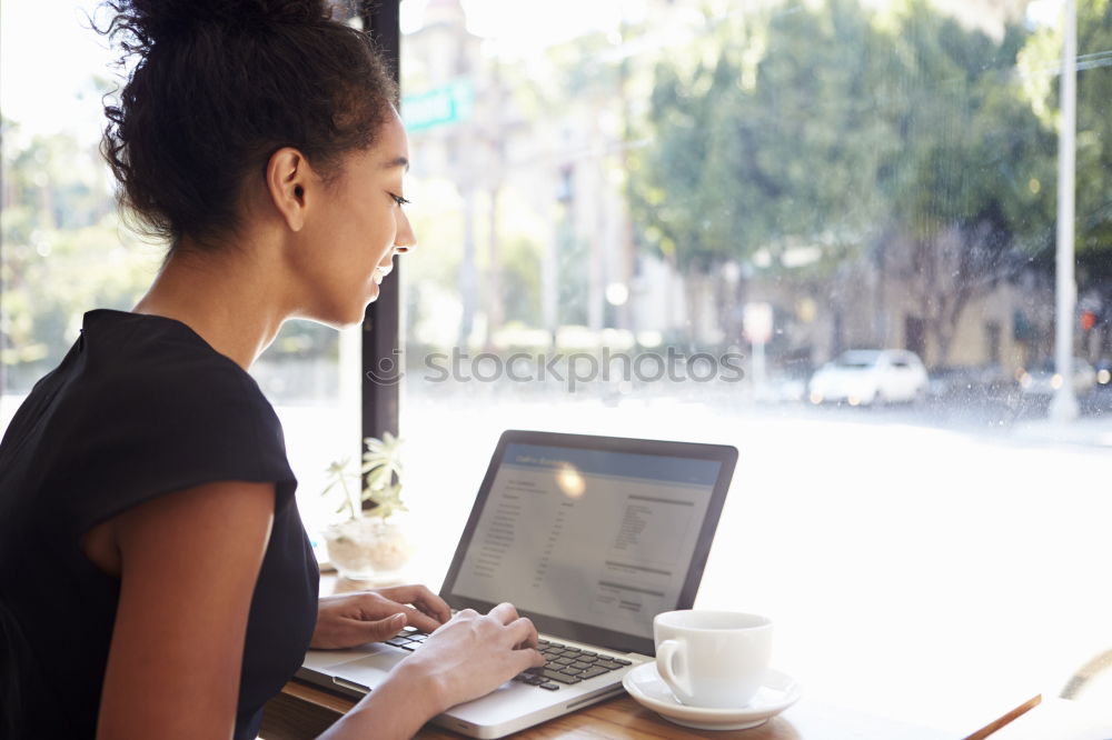 Similar – Beautiful afro american woman using mobile and laptop in the coffee shop.