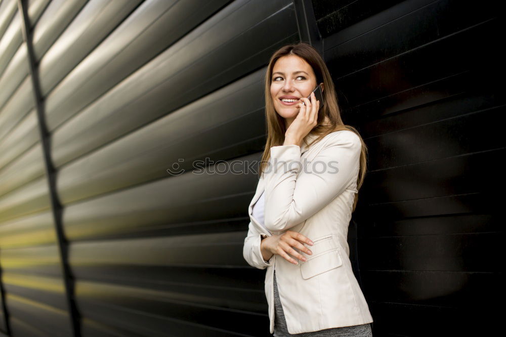 Similar – Young woman wearing casual clothes smiling in urban background