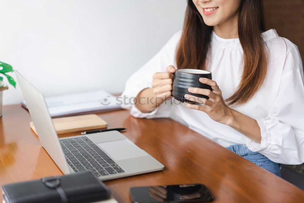 Similar – Image, Stock Photo brunette woman is using her computer while having a coffee