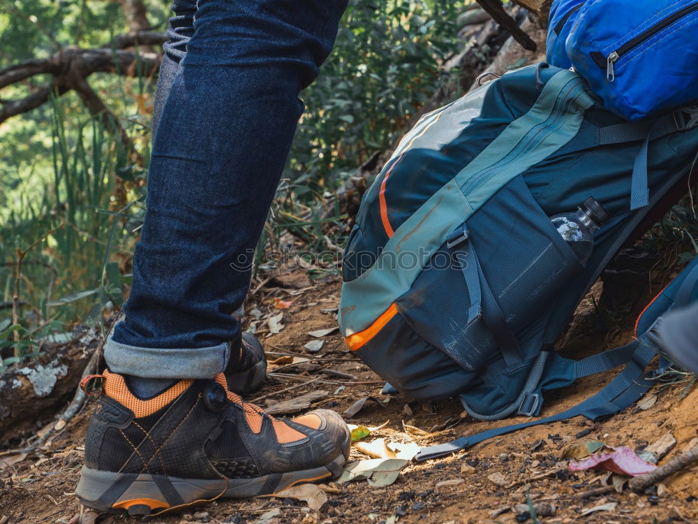 Similar – Hiker closing his partner’s backpack