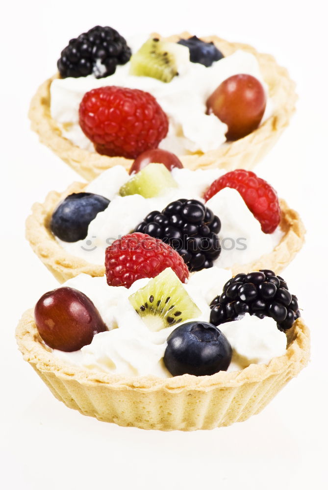 Similar – Delicious tartlets with raspberries and blueberries