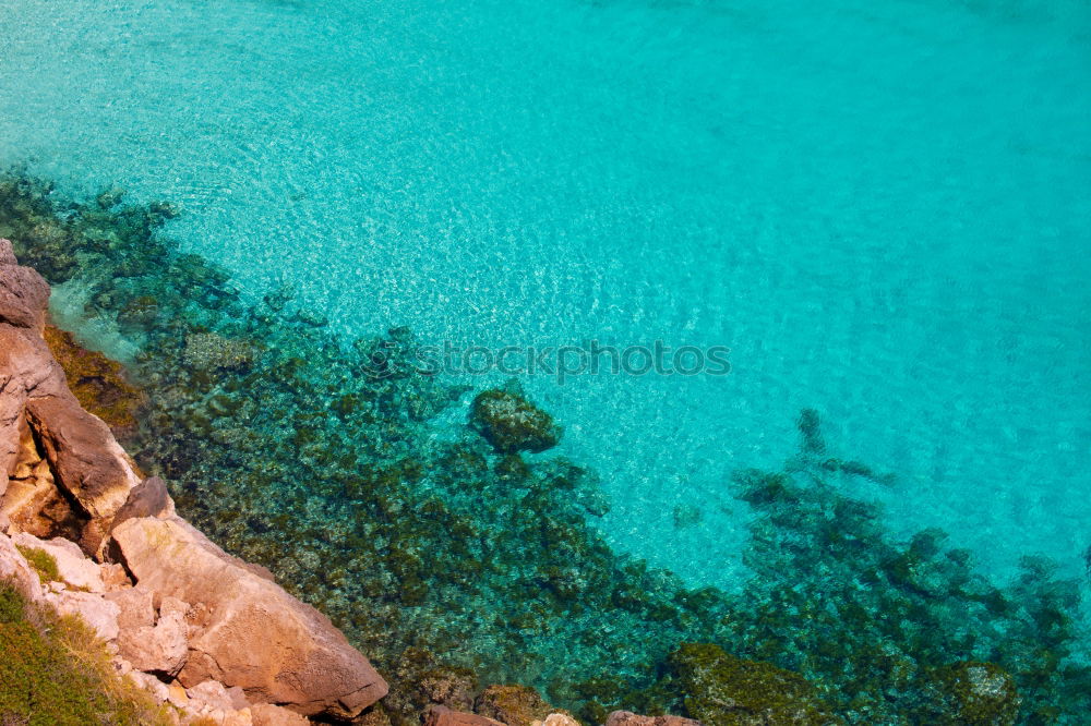 Similar – Boat anchors in rocky bay with turquoise blue sea from above