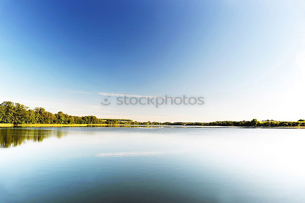 Similar – Tranquil, calm Rhine river scene with arched bridge