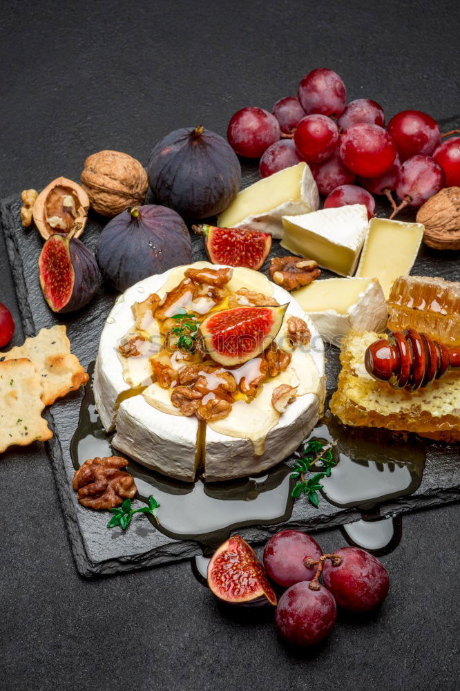 Similar – Image, Stock Photo Rustic cheese platter with various cheeses