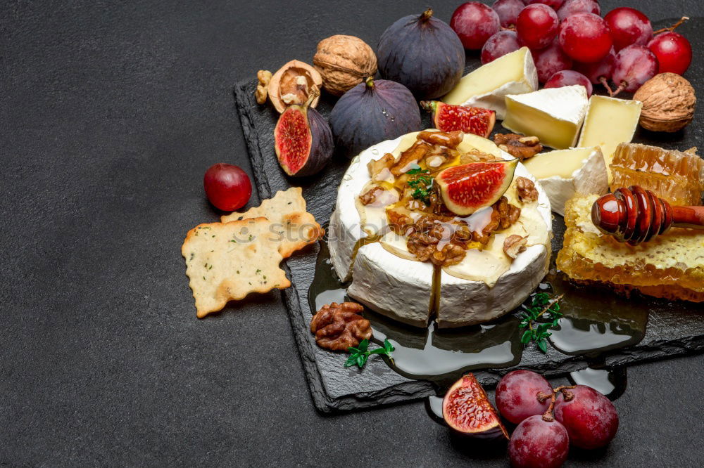 Similar – Image, Stock Photo Rustic cheese platter with various cheeses