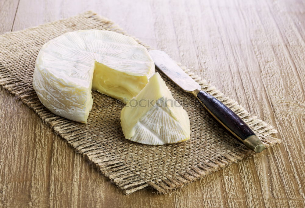 Similar – Image, Stock Photo parmesan cheese on plate of wood