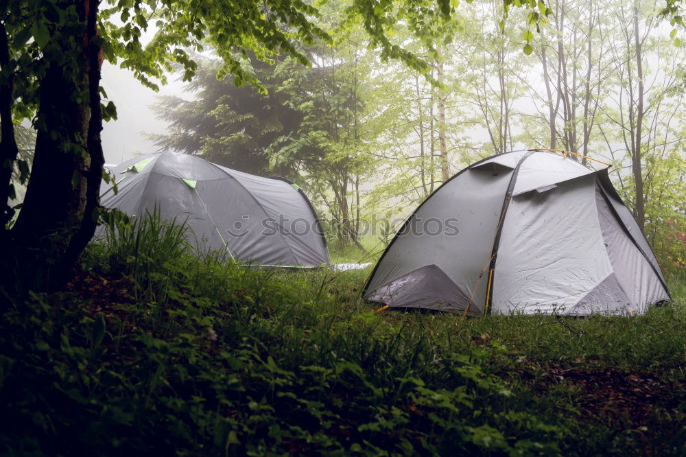 Similar – Tent in storm and rain in an autumn landscape