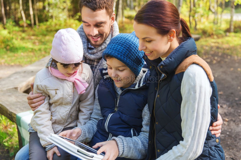 Similar – Family spending vacation time together having a snack sitting on jetty over the lake on sunny day in the summertime