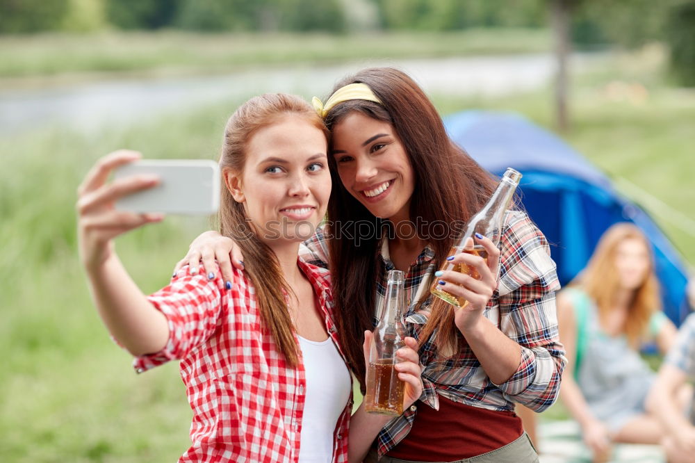 Similar – Beautiful women taking a selfie portrait in the park.