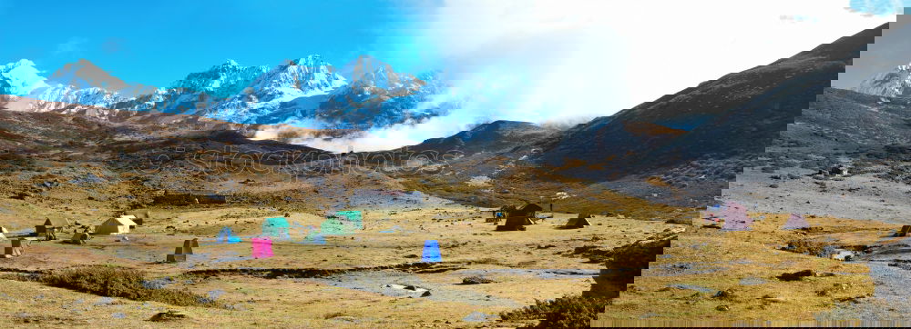 Campsite with tents on the top of high mountains. Panorama