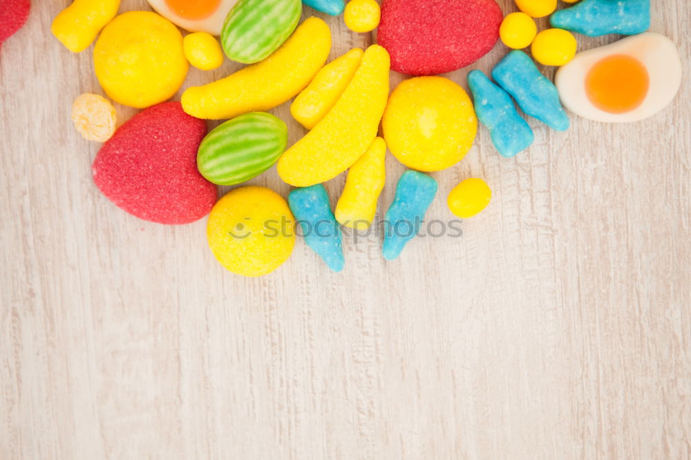 Colourful ice cream on a stick and fresh fruit