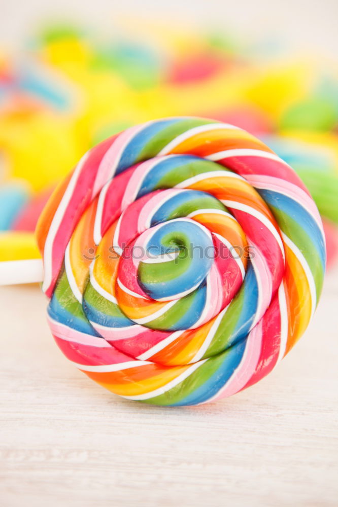 Similar – Image, Stock Photo Colorful lollipops on blue background. Top view.