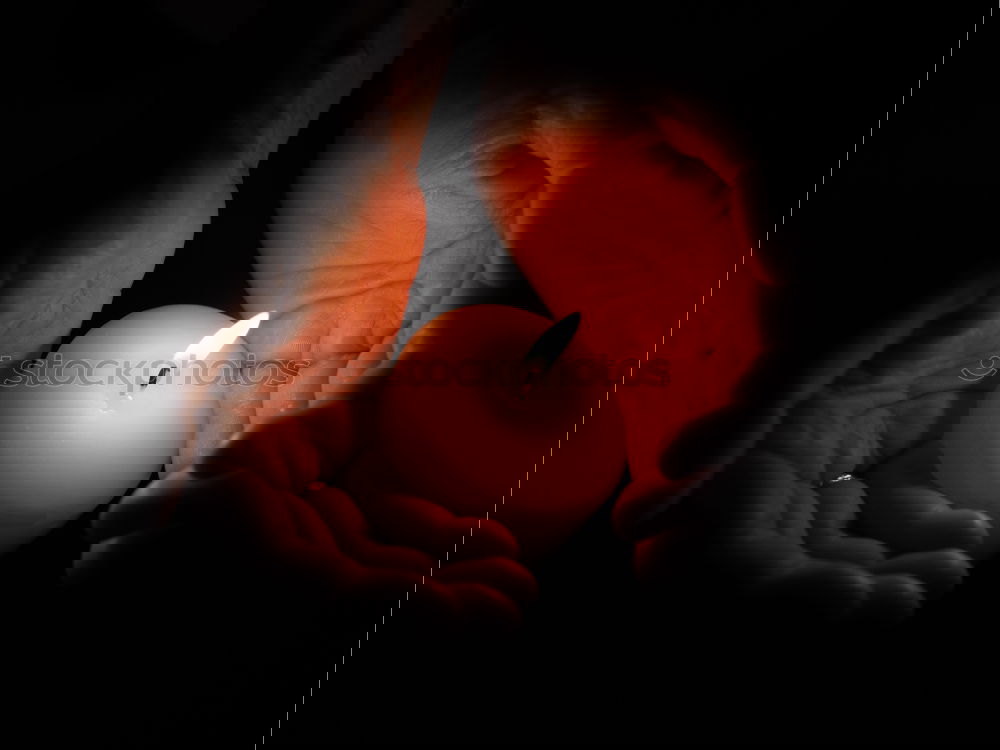 Similar – Foto Bild eine Kerze leuchtet in der Dunkelheit und spendet wärme