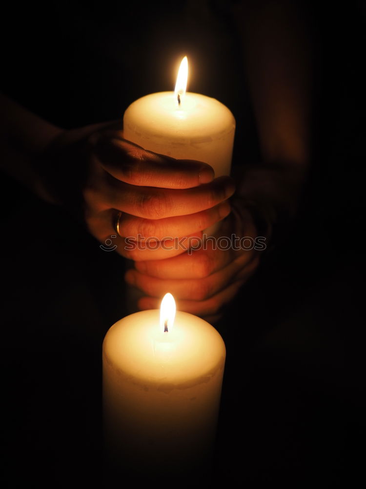 Similar – burning candle in lantern as a sign of hope