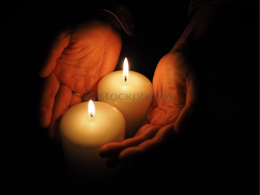 Similar – Image, Stock Photo Flickering candle in hands of young woman