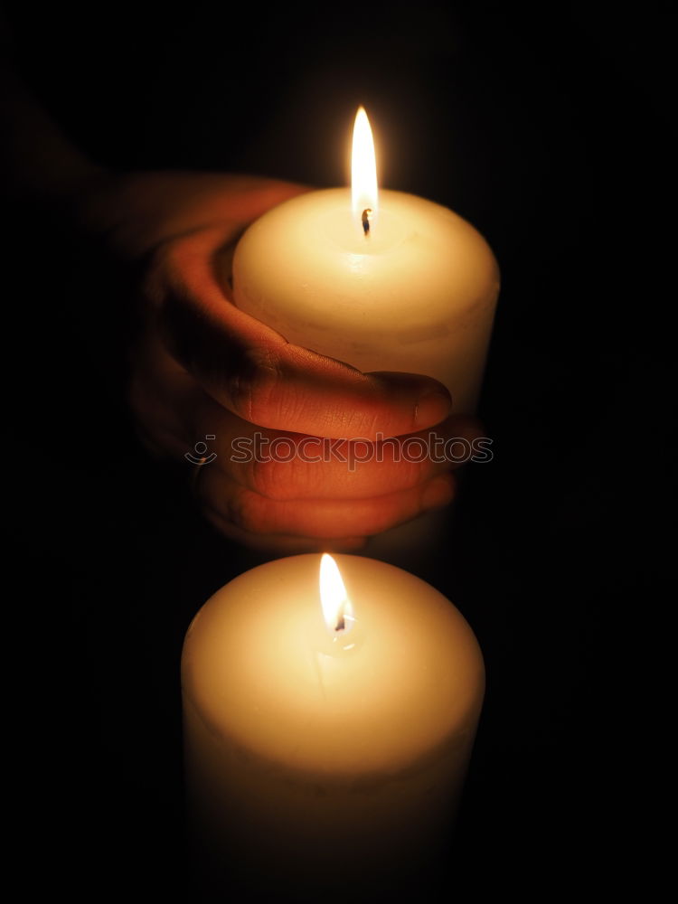 Similar – Image, Stock Photo Burning candle in a hand. Weak depth of field with blue background and some shine.