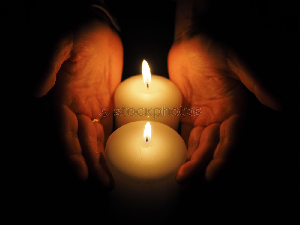 Similar – Holding a burning candle in your hands