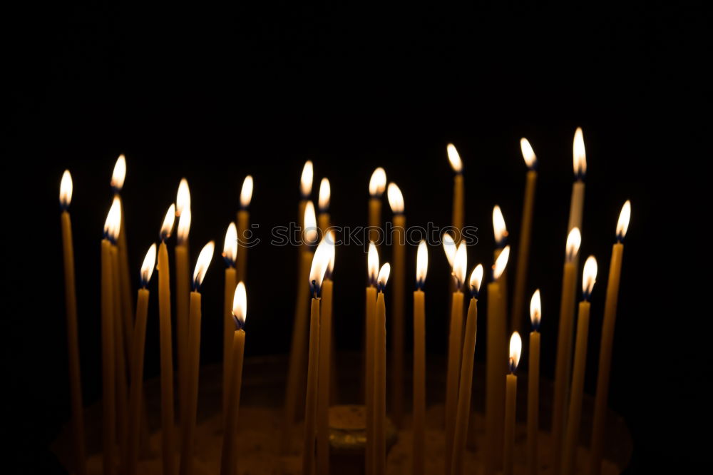 Similar – long lighted candles group in orthodox church. candles background. selective focus