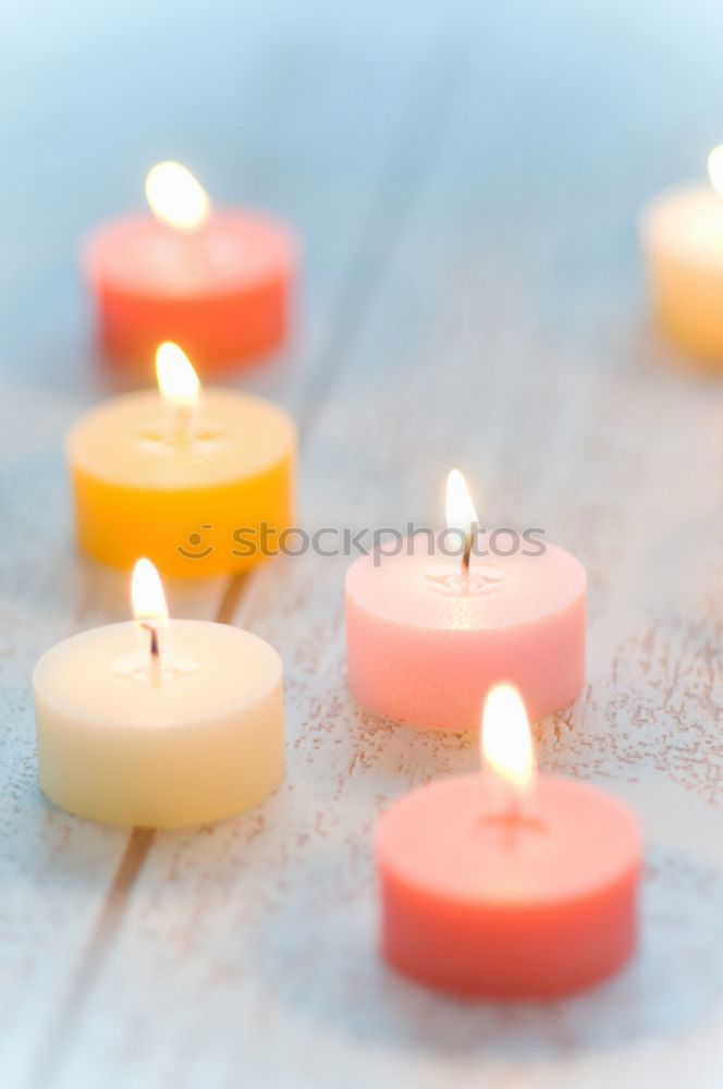 Similar – Lit candle isolated on a pink background. Aromatic pink candle burning