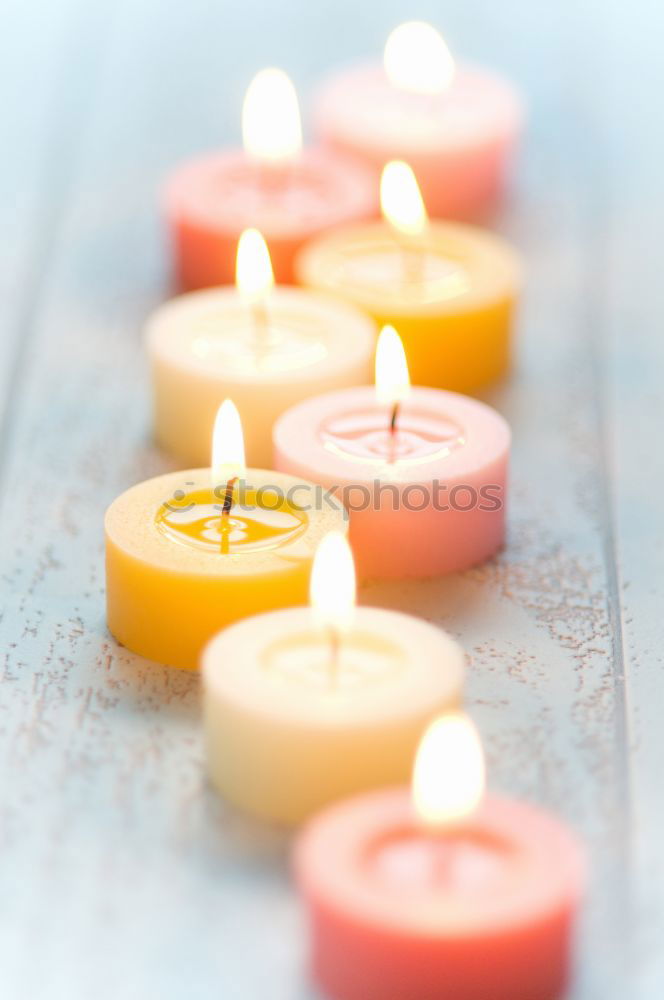 Similar – Lit candle isolated on a pink background. Aromatic pink candle burning