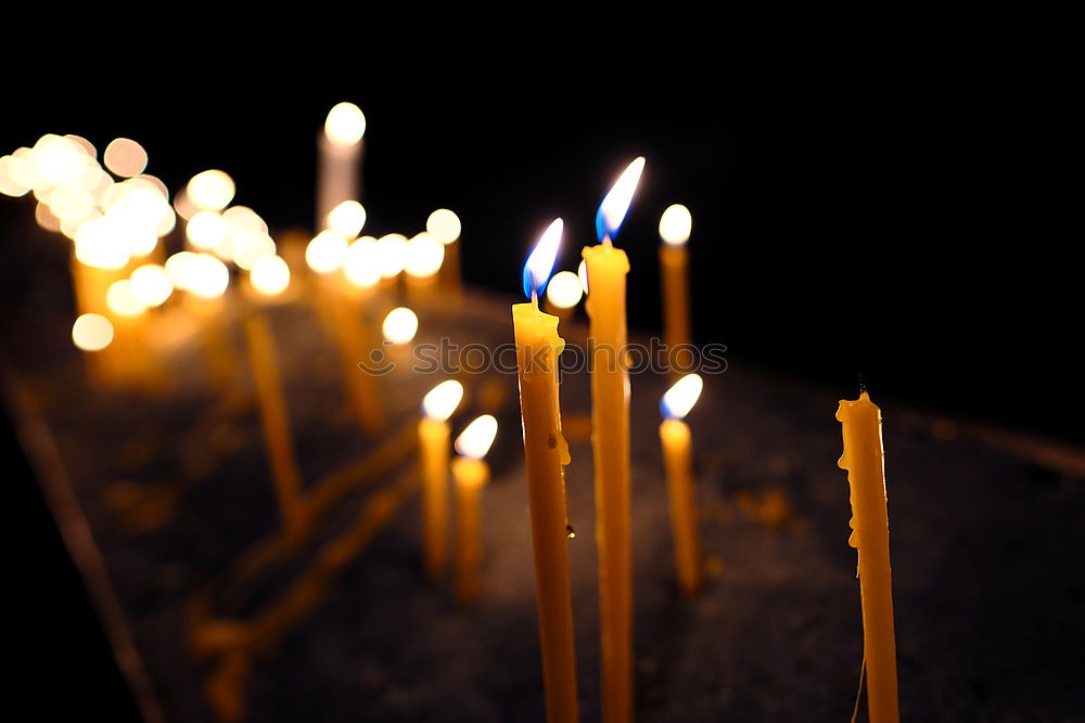 Similar – long lighted candles group in orthodox church. candles background. selective focus