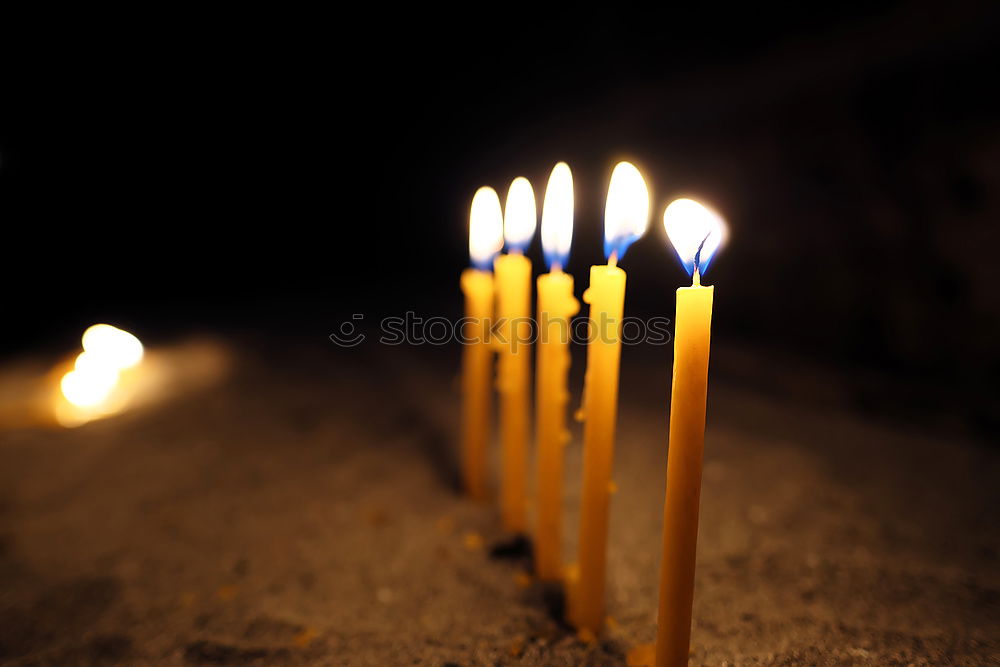 Similar – long lighted candles group in orthodox church. candles background. selective focus