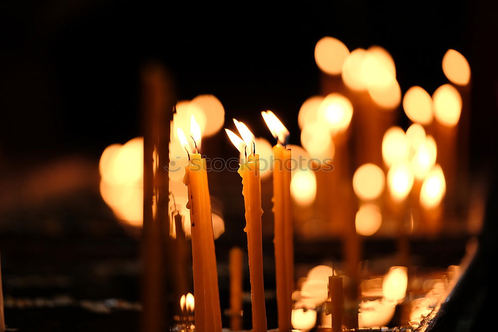 Similar – long lighted candles group in orthodox church. candles background. selective focus