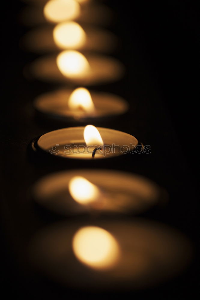 Similar – Image, Stock Photo Burning candle in a hand. Weak depth of field with blue background and some shine.