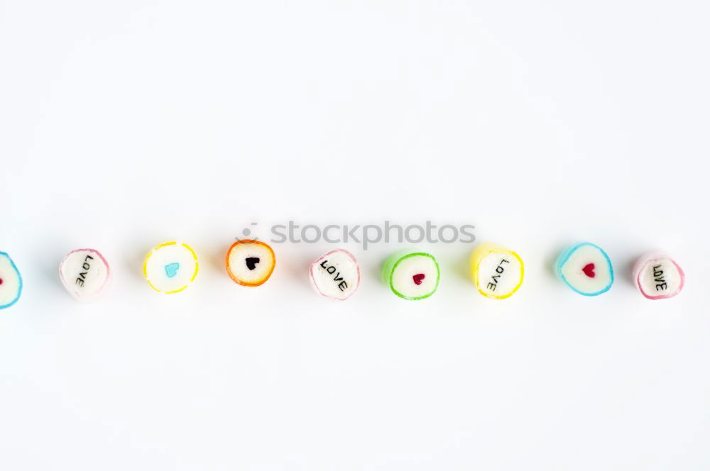 Similar – Image, Stock Photo Number 3 laid out of small chocolate candies with colored sugar sprinkles on white background