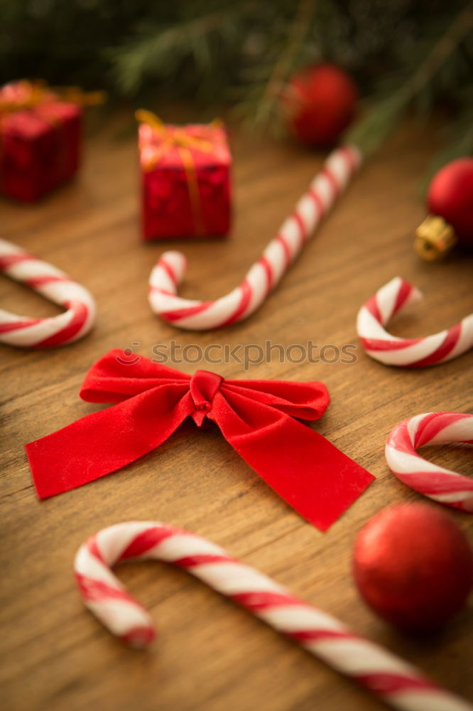 Similar – Image, Stock Photo Christmas parcel with red bow on wooden background.