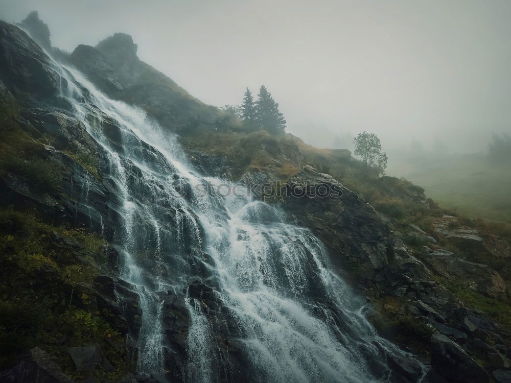 Similar – Waterfall on Iceland with man