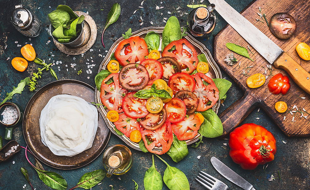 Similar – Colourful tomatoes with mozzarella cheese on the kitchen table