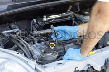 Similar – Professional Mechanic Repairing Car.