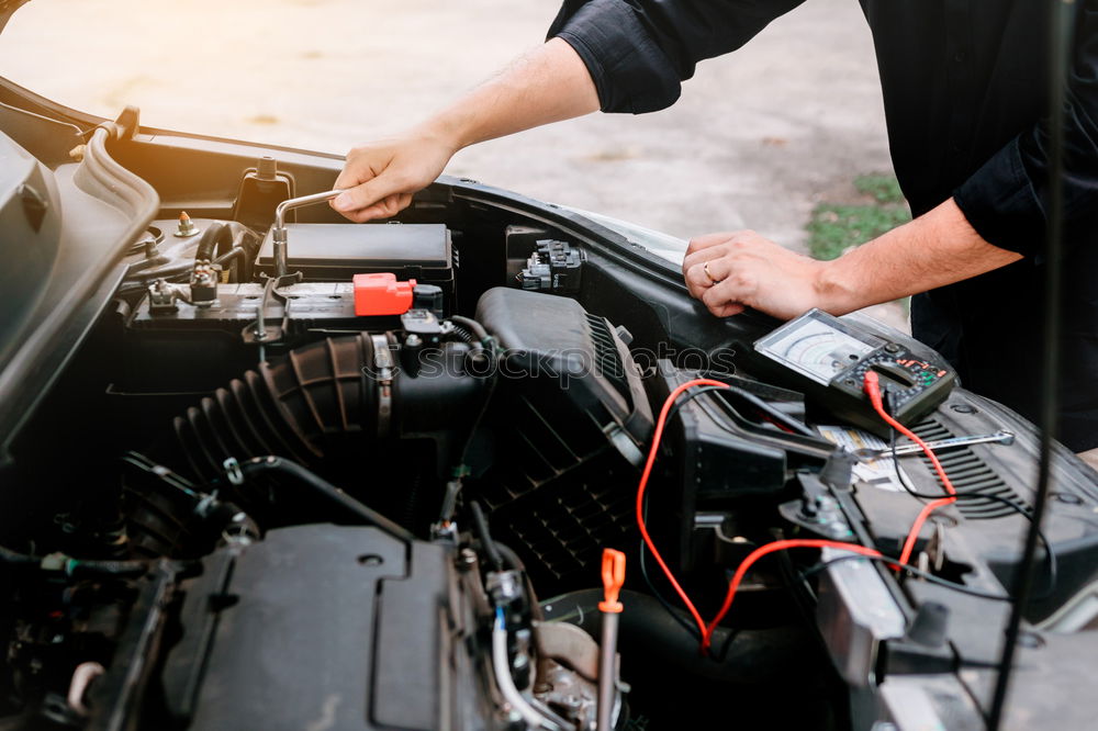 Similar – Motorcycle mechanic changing a fuse