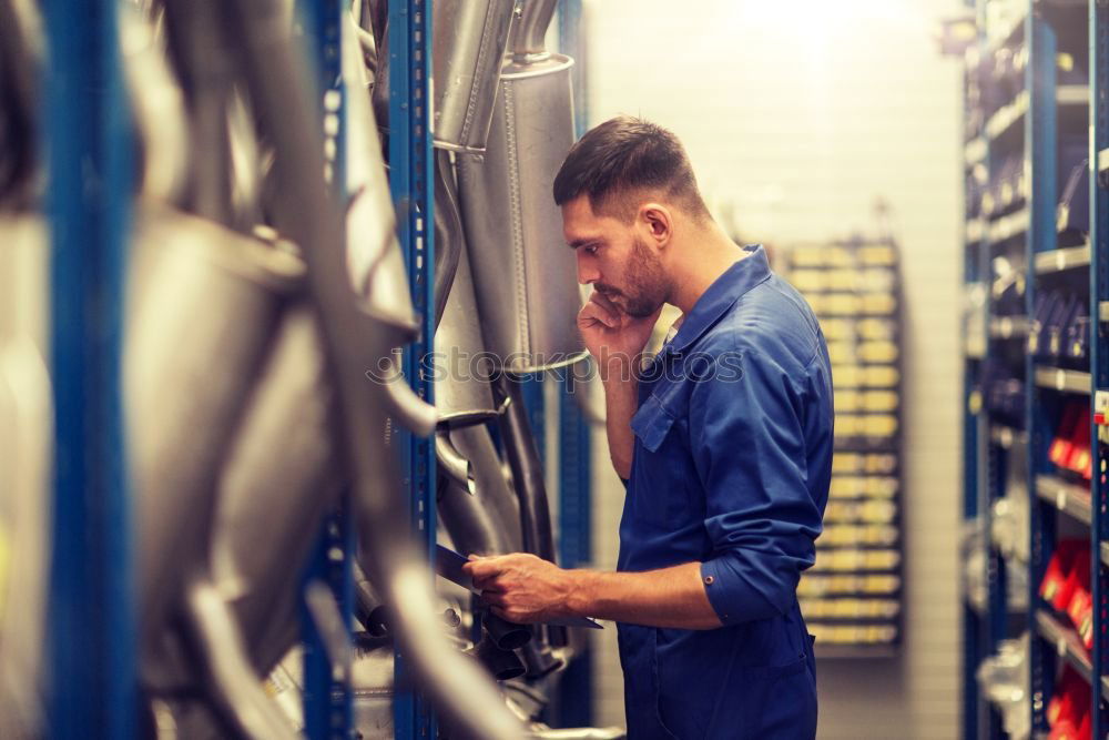 Similar – Professional Mechanic Repairing Car.