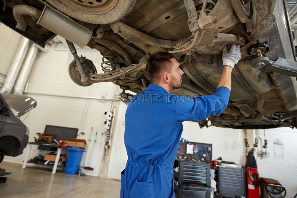 Similar – Image, Stock Photo Mechanic checking motorcycle