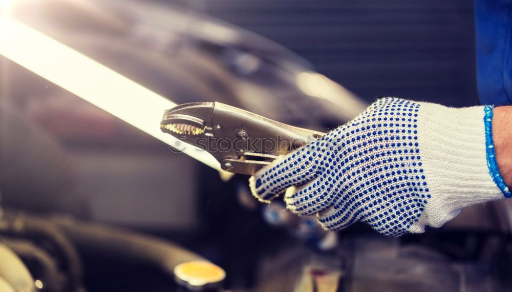 Professional Mechanic Repairing Car Engine.